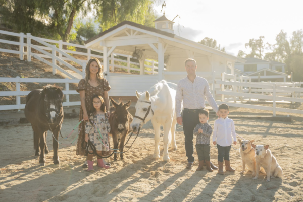 Esther Hahn with her family posing in front of their barn in Calabasas, CA.